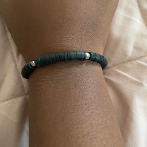black bracelet with silver square bead